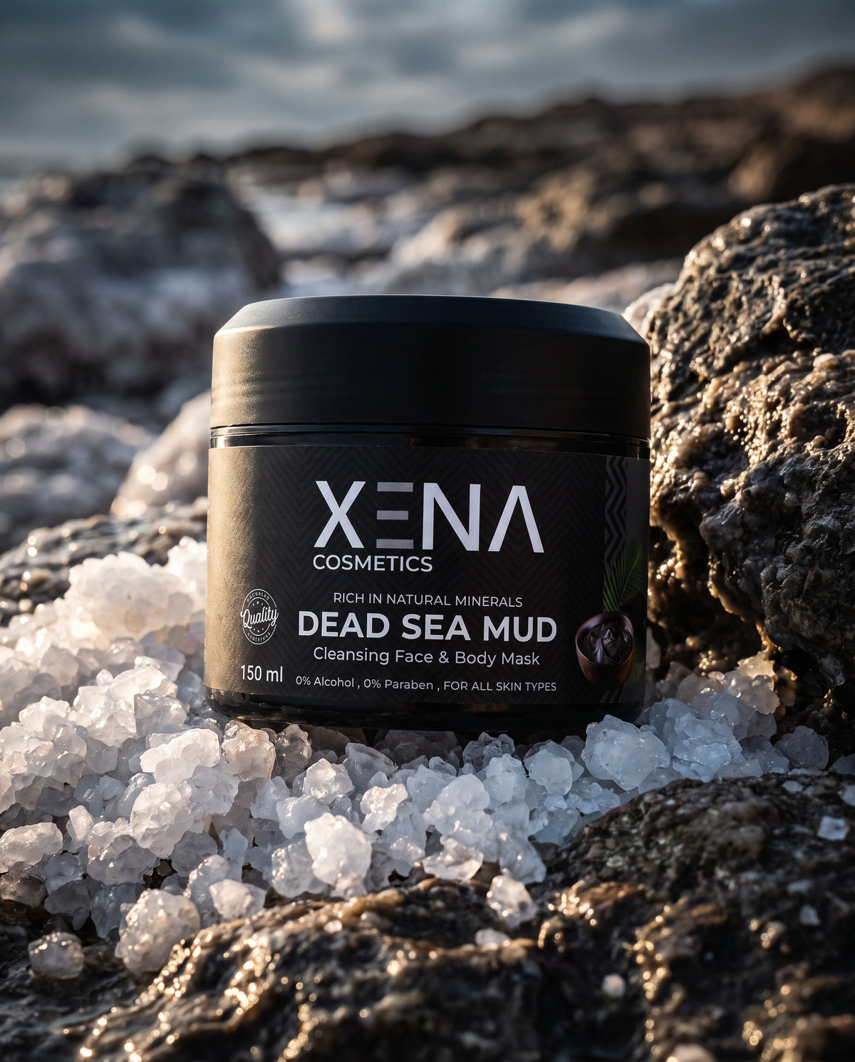 XENA Dead Sea Mud Mask jar on dark rock and salt crystals